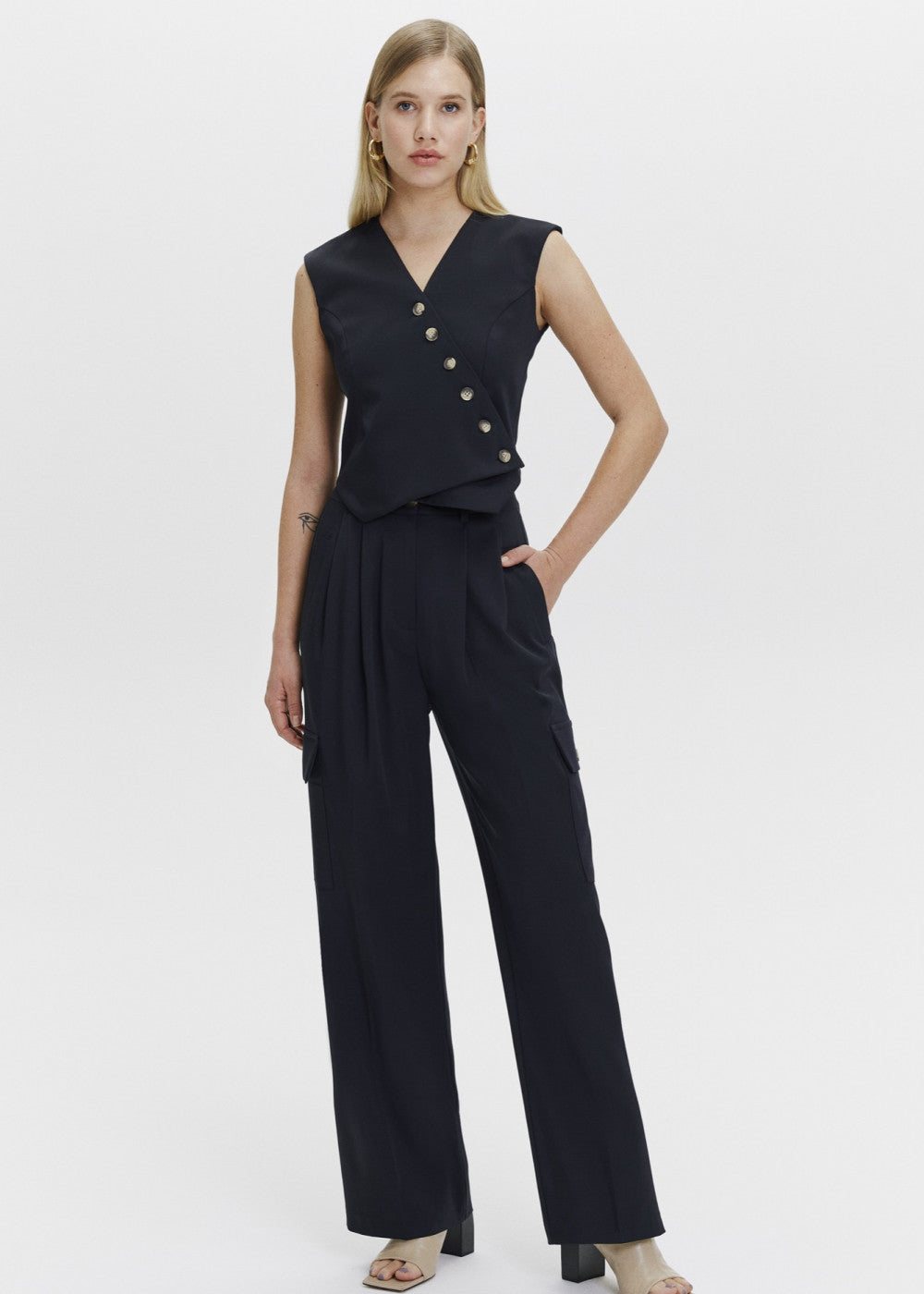 Asymmetric detailed vest and cargo trousers